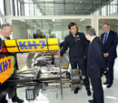 Pedro de la Rosa shows FIA president Jean Todt around the race bays at HRT's new base