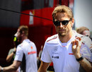 Jenson Button arrives in the paddock on Thursday