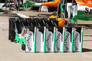 Force India front wings neatly stacked in the pit lane