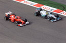 Fernando Alonso and Nico Rosberg battle for position 