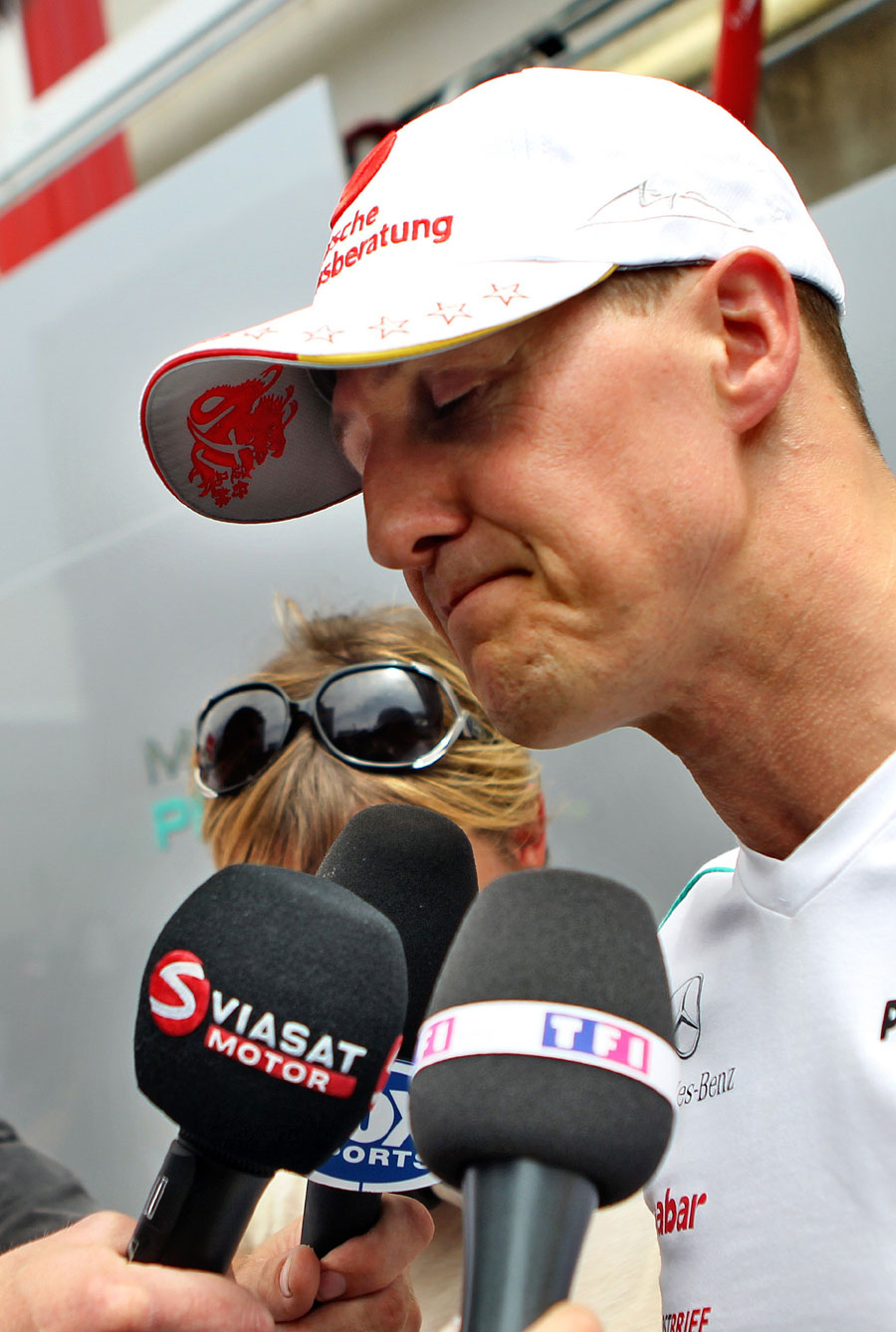 An angry Michael Schumacher faces the press