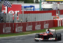 Fernando Alonso crosses the line to take second