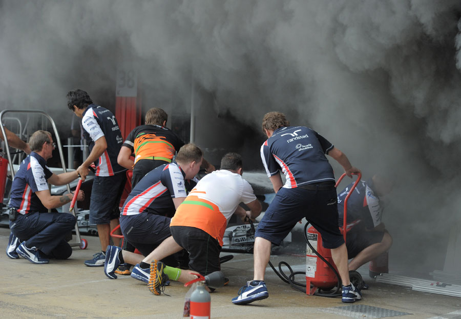 Mechanics tackle the blaze in the Williams garage