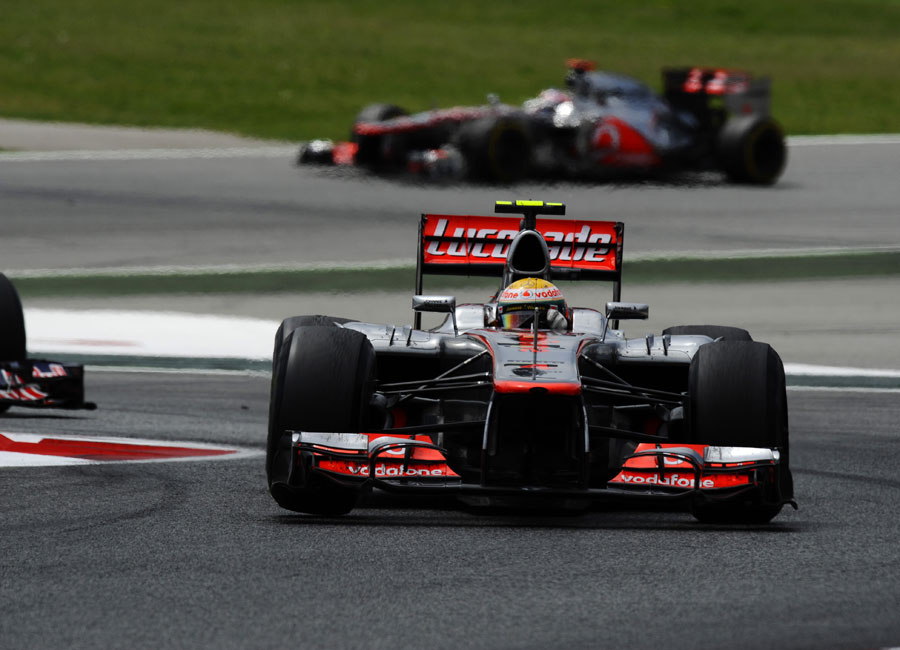 Lewis Hamilton tackles the final chicane with Sebastian Vettel and Jenson Button behind