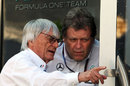 Bernie Ecclestone chats with Mercedes motorsport boss Norbert Haug