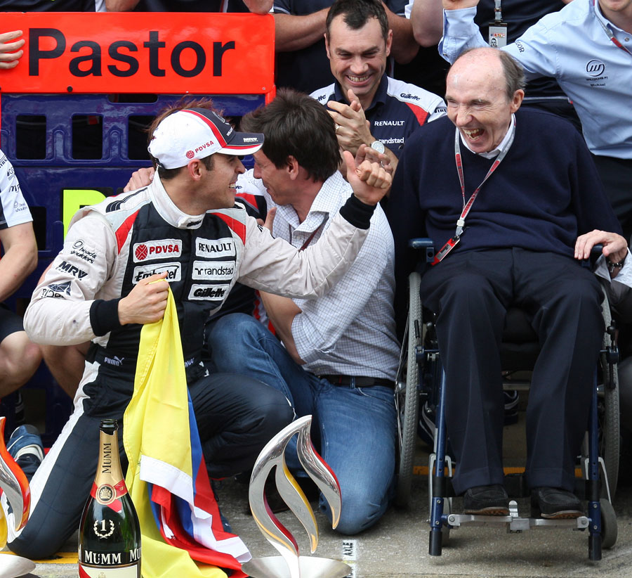 Pastor Maldonado celebrates his maiden win with a delighted Sir Frank Williams