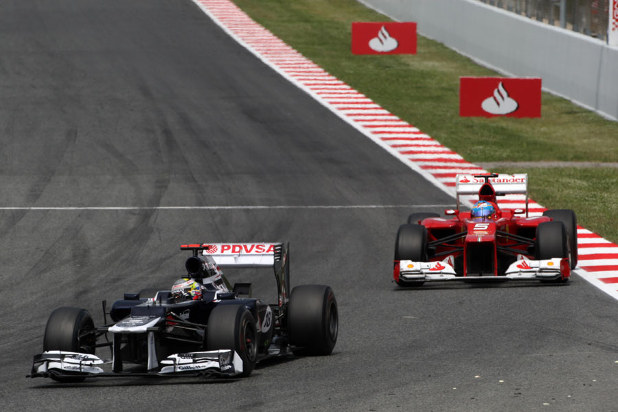 Pastor Maldonado leads Fernando Alonso in the closing laps