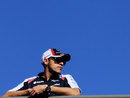 Pastor Maldonado watches on from the top of the pit building