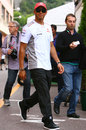 Lewis Hamilton walks through the Monte Carlo paddock