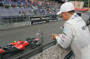 Michael Schumacher looks on during FP2