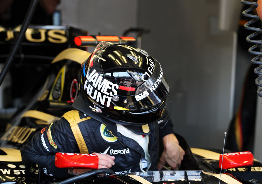 Kimi Raikkonen climbs out of the cockpit of his Lotus