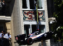 Pastor Maldonado's Williams is craned away after a crash at Casino Square