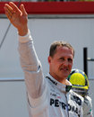 Michael Schumacher waves to the crowd after taking pole