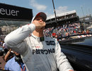 Michael Schumacher blows kisses to the crowd after taking pole position at Monaco