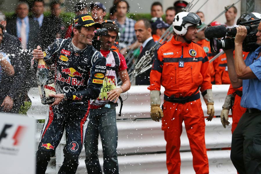 Mark Webber sprays champagne after winning in Monaco