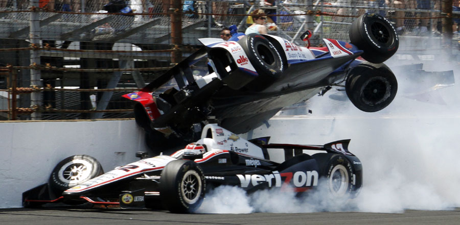 Will Power drives under an airborne Mike Conway after they made contact at the Indy 500