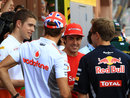 Fernando Alonso chats with Paul di Resta, Jenson Button and Sebastian Vettel