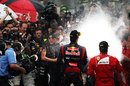 Mark Webber and Fernando Alonso spray the champagne