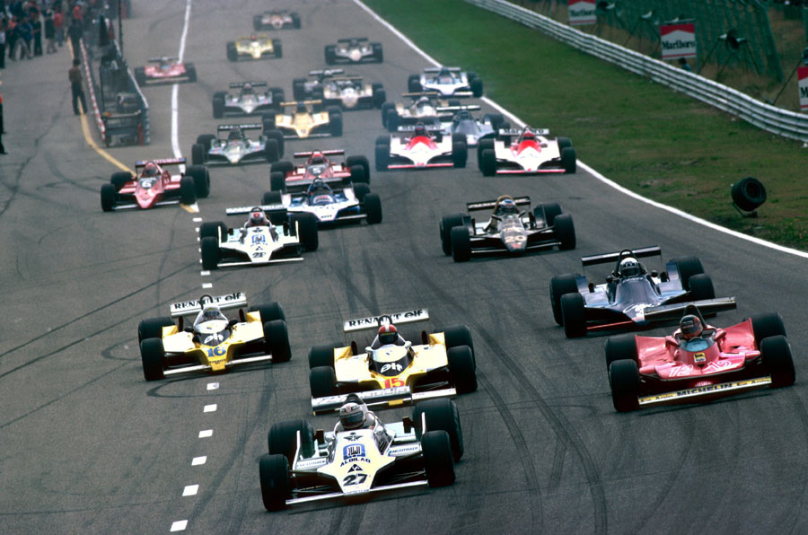 Alan Jones leads Gilles Villeneuve and the Renaults in to turn one as Carlos Reutemann loses a wheel