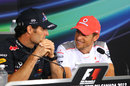 Jenson Button jokes with Mark Webber in the driver press conference