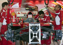 Ferrari mechanics at work on Thursday