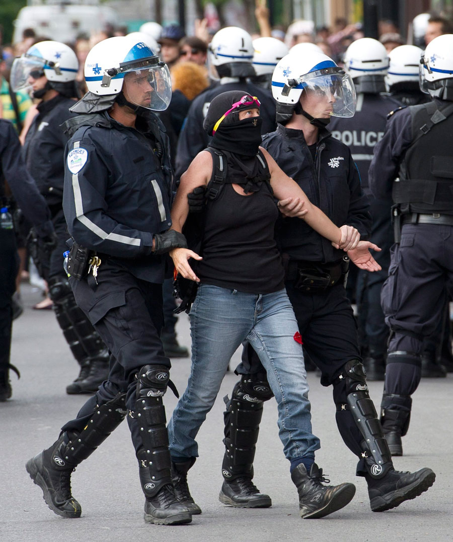Police arrest a demonstrator trying to disrupt the opening gala ahead of the Canadian Grand Prix