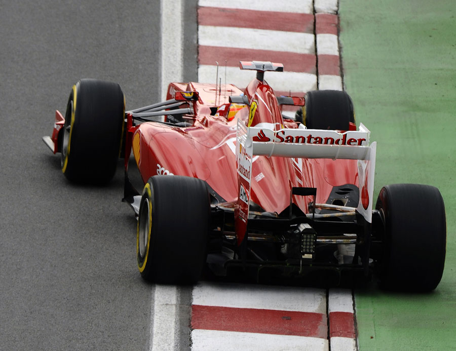 Fernando Alonso holds a slide in the Ferrari