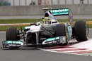 Nico Rosberg hops over the kerbs in his Mercedes