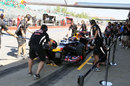 Mark Webber completes a practice pit stop