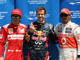 Sebastian Vettel celebrates taking pole position ahead of Lewis Hamilton and Fernando Alonso in Canada