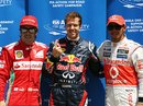 Sebastian Vettel celebrates taking pole position ahead of Lewis Hamilton and Fernando Alonso