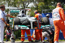 Nico Rosberg's Mercedes is recovered at the start of FP3