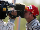 Rubens Barrichello kisses a TV camera