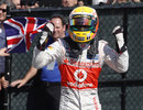 Lewis Hamilton celebrates his victory in parc ferme