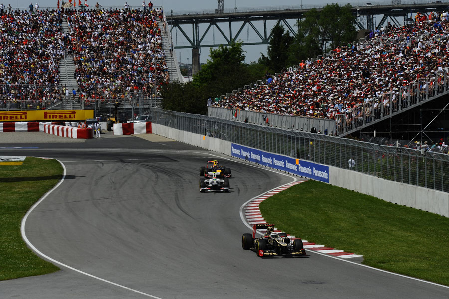 Kimi Raikkonen leads Sergio Perez and Mark Webber out of the hairpin