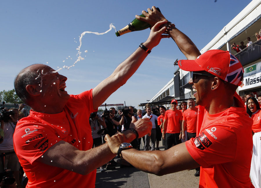 Lewis Hamilton celebrates his victory with McLaren chairman Ron Dennis