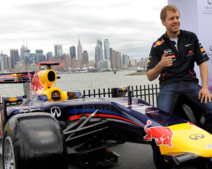 Sebastian Vettel poses in front of the Manhattan skyline