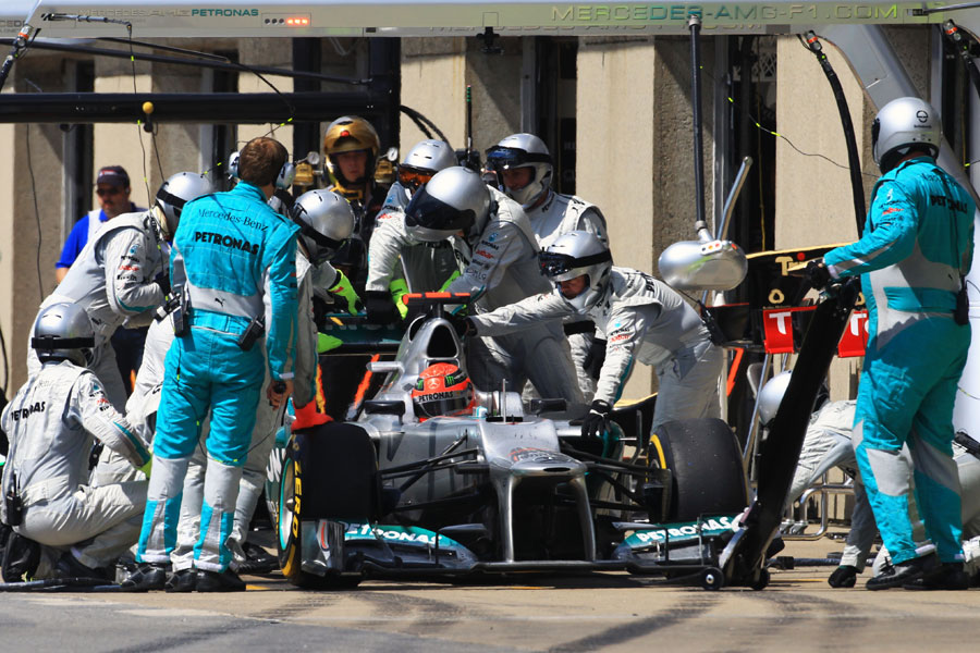 Mercedes mechanics work on Michael Schumacher's broken DRS