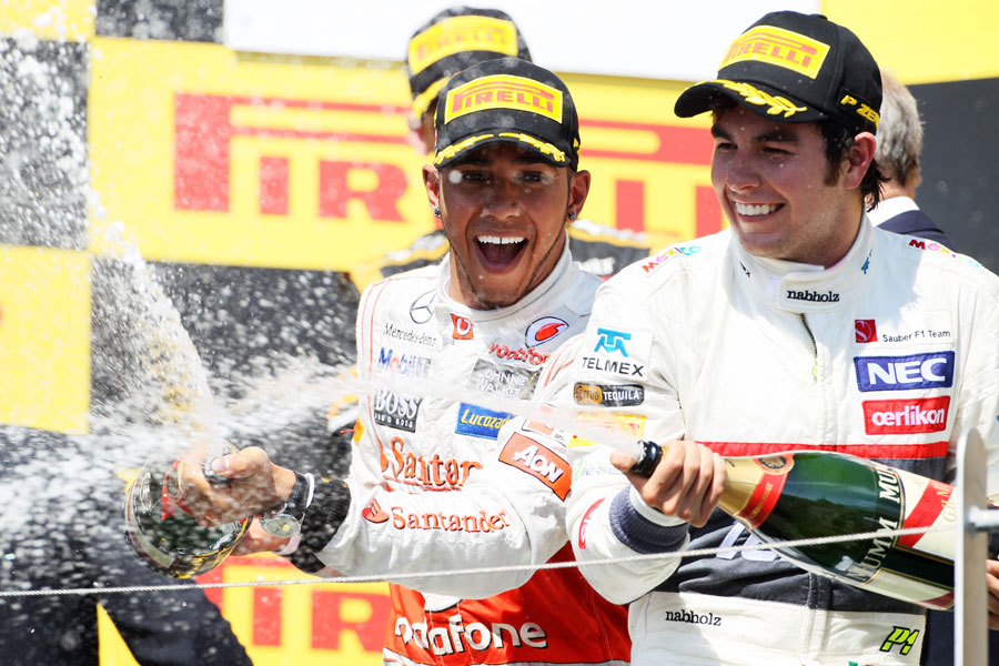 Lewis Hamilton and Sergio Perez celebrate on the podium