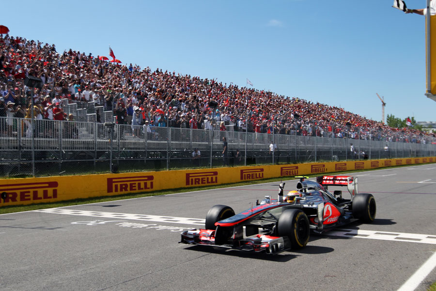 Lewis Hamilton celebrates as he crosses the line