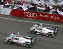 Audi's Andre Lotterer takes the chequered flag ahead of team-mate Tom Kristensen at Le Mans