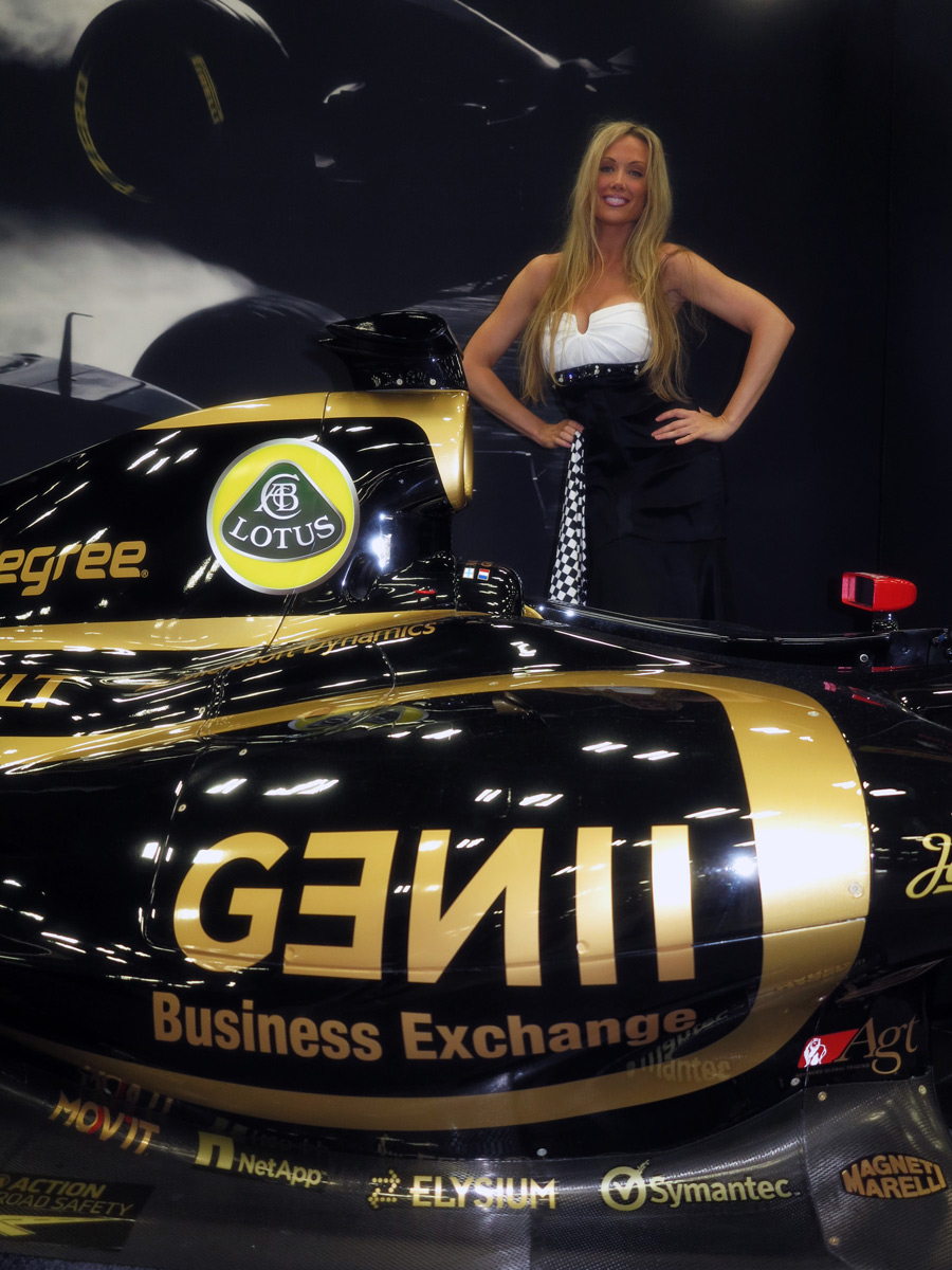 A glamour model poses with a Lotus at the Formula One Expo in Austin