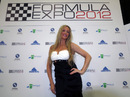 A glamour model poses  at the Formula One Expo in Austin