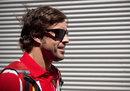 Fernando Alonso arrives in the paddock on Thursday
