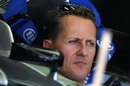 Michael Schumacher looks pensive in the Mercedes garage