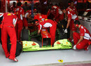 Fernando Alonso's Ferrari doused in aero paint at the start of first practice