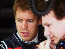 Sebastian Vettel talks with Christian Horner in the Red Bull garage