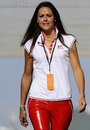 A Ferrari employee arrives in the paddock