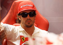 Fernando Alonso relaxes in the Ferrari garage