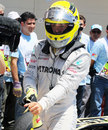 Nico Rosberg gets out of his car in parc ferme